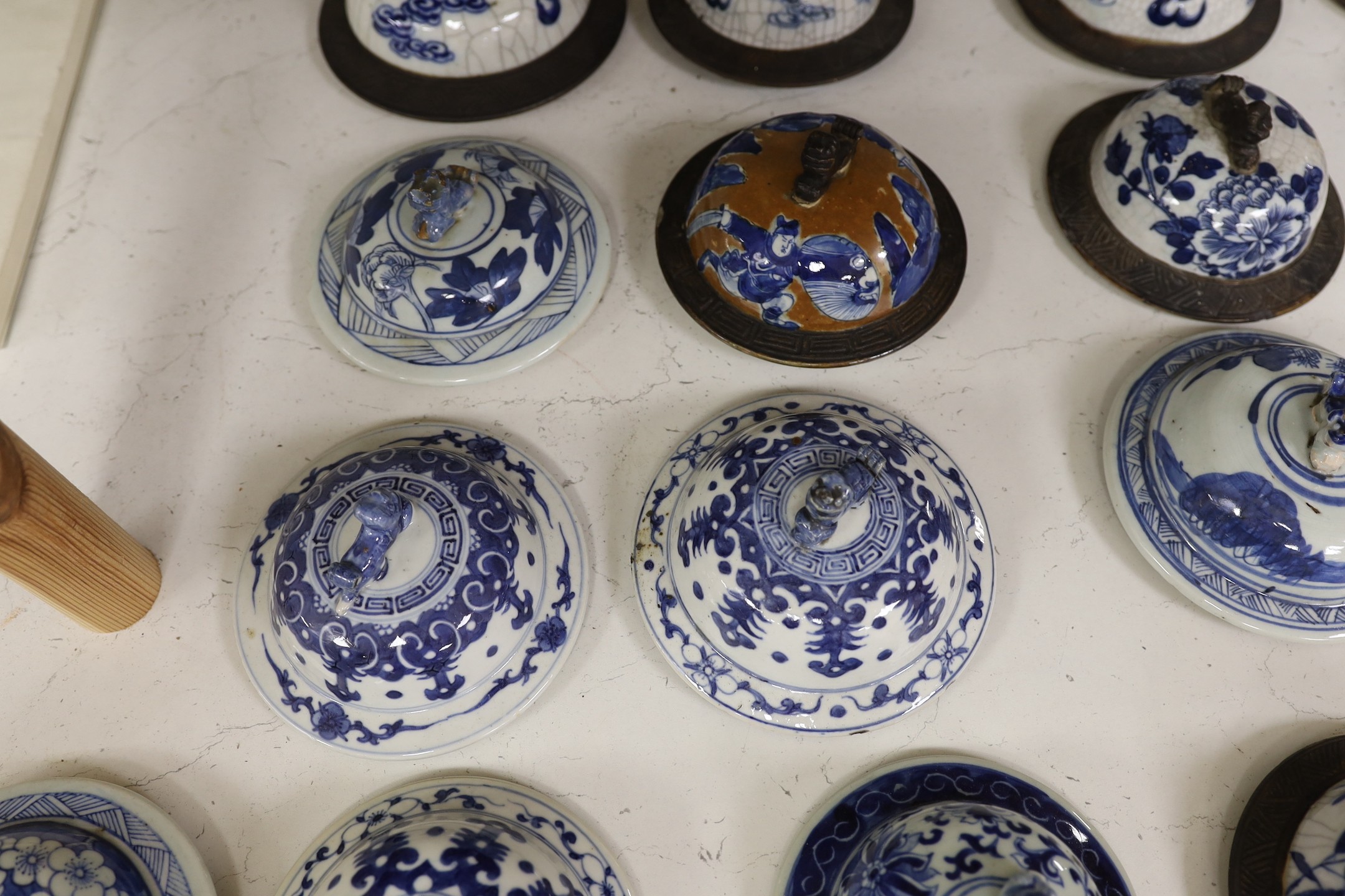 Thirty-seven 18th/19th century Chinese blue and white porcelain covers, 17cm diameter, Provenance - D.C.Monk & Son, former dealers based in Kensington Church Street, London W8